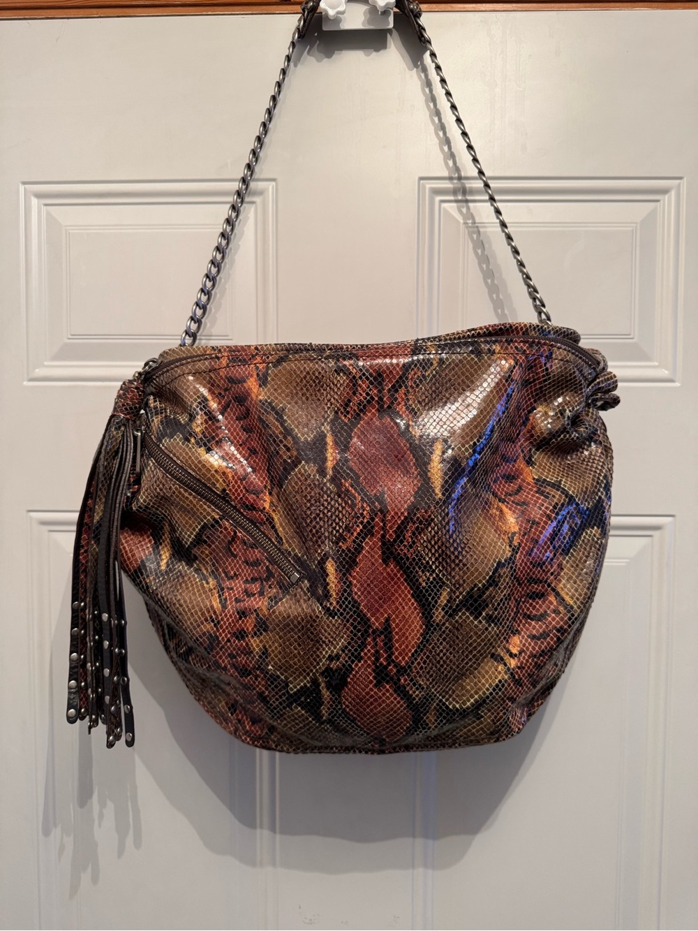Botkier Ava snake embossed leather hobo bag with a chain strap.